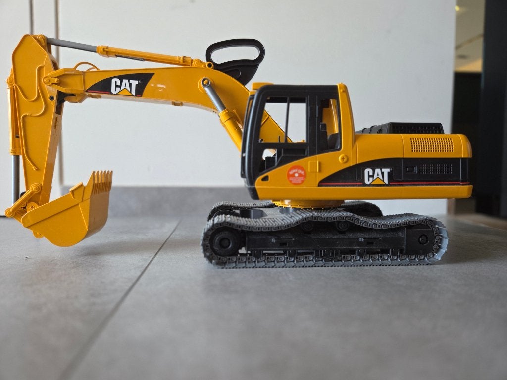 Bruder excavator CAT grijper BRO 2483, Ophalen, Zo goed als nieuw