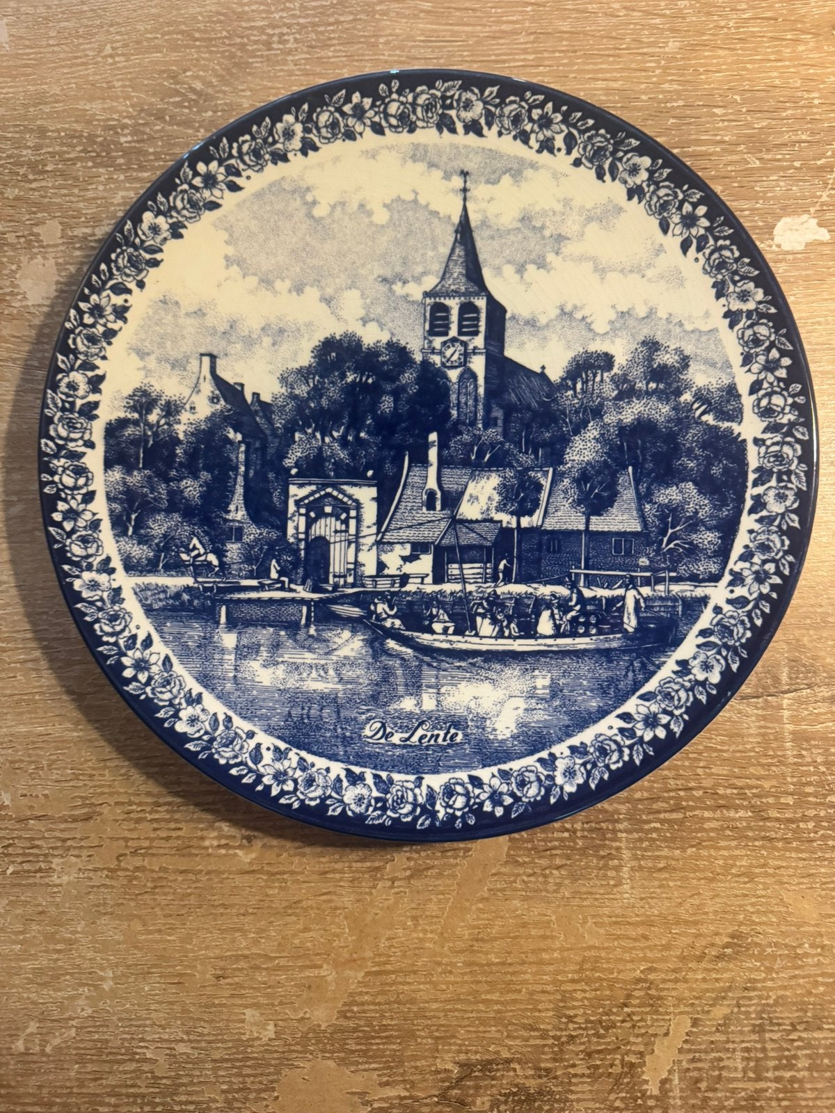 De lente delfts blauw wand bord, Ophalen
