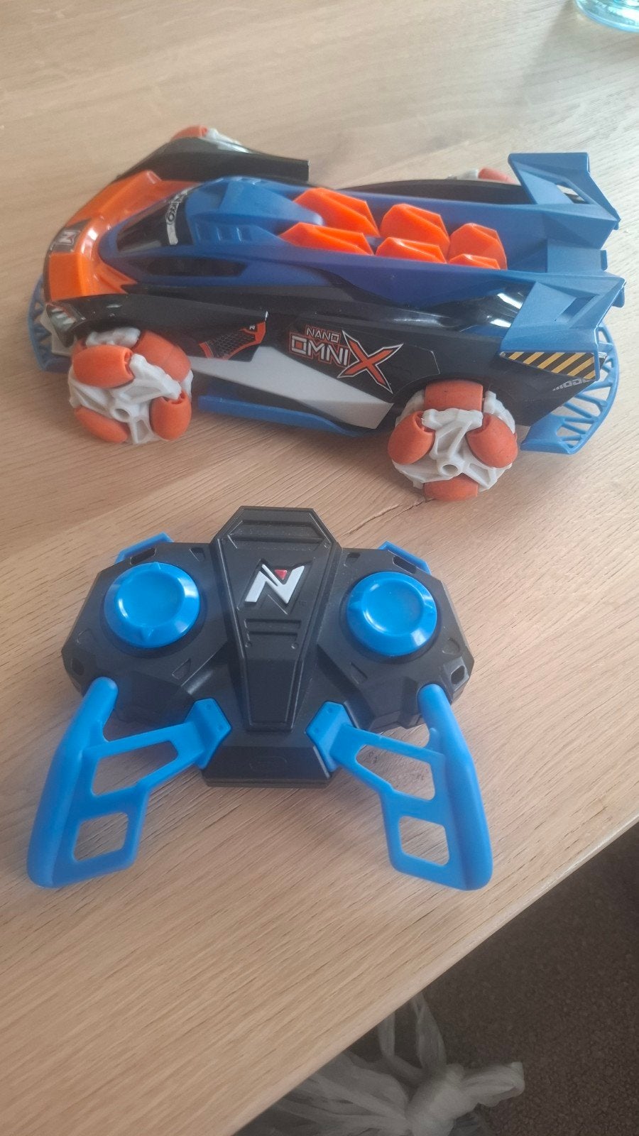 Nikko Nano Omni X Bestuurbare Auto - Oranje/Blauw, Hobby en Vrije tijd, Modelbouw | Radiografisch | Auto's, Zo goed als nieuw