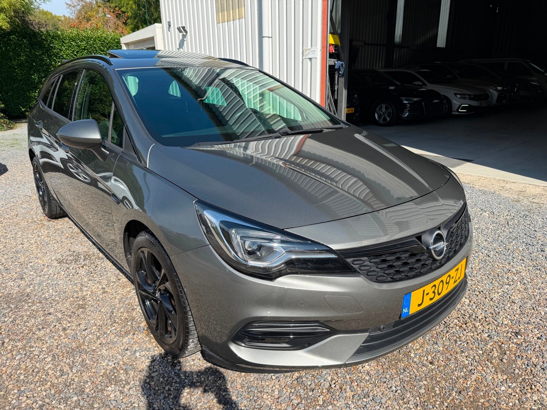 Opel Astra Sports Tourer 1.4 Ultimate AUT.DAKJE.NAVI.NEW-APK, Auto's, Gebruikt, 146 pk, Origineel Nederlands, 3 cilinders