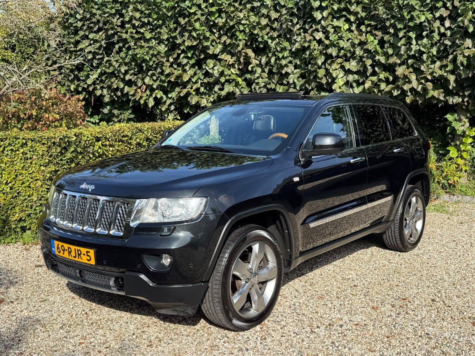 Jeep Grand Cherokee 3.6 Overland 2011 Zwart Panoramadak, Auto's, Automaat, Zwart, Vierwielaandrijving, Particulier