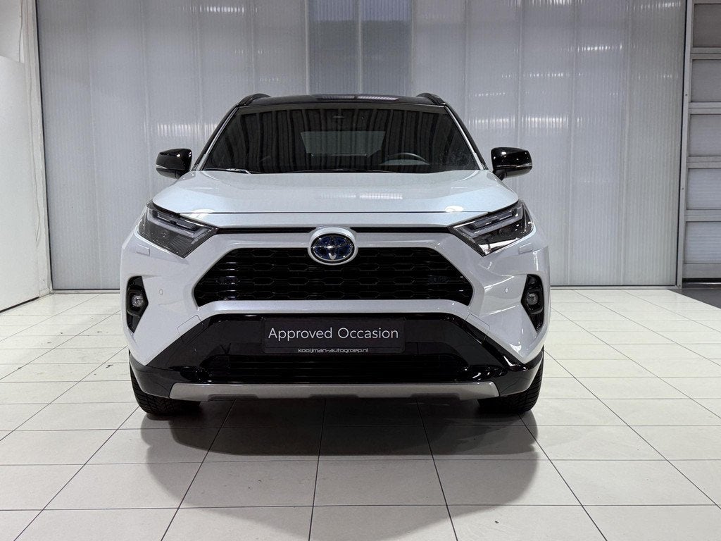 Toyota RAV4 AWD 2.5 Hybrid Bi-Tone Automaat, Auto's, Toyota, Automaat, Gebruikt, Euro 6, 4 cilinders