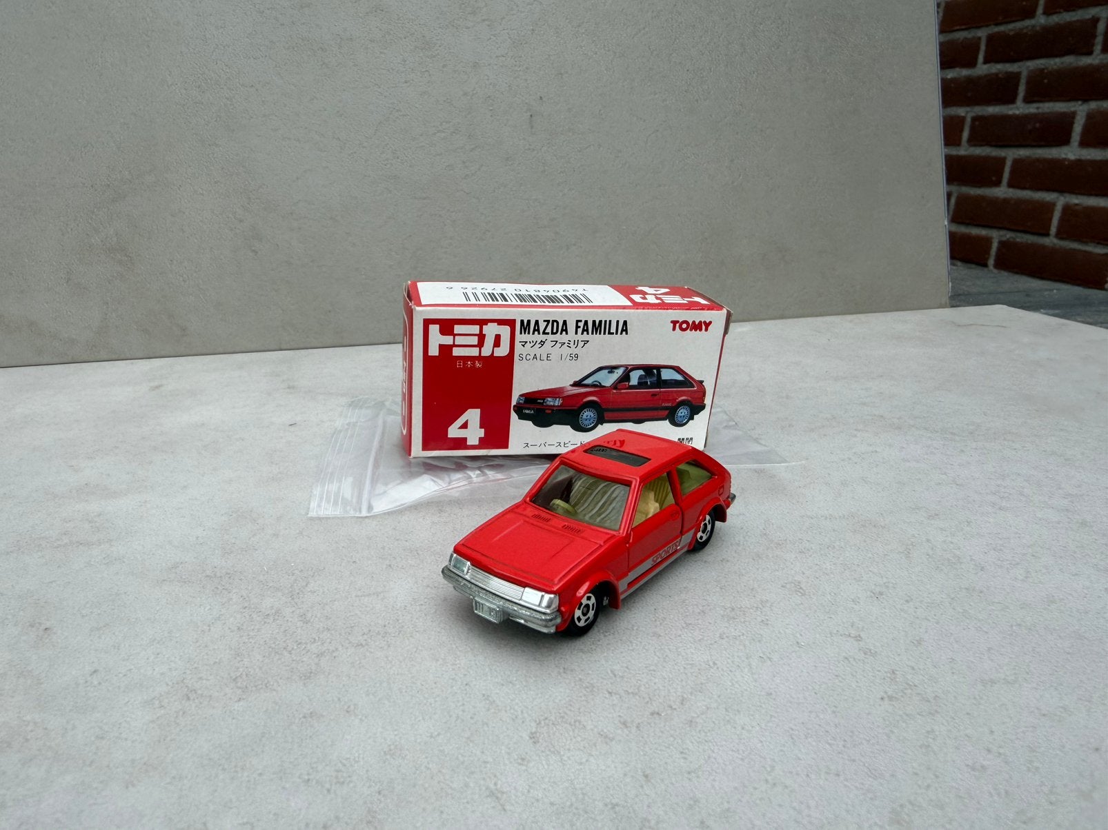 1/59 MAZDA 323 TOMICA M BOX, Ophalen of Verzenden, Nieuw, Bus of Vrachtwagen