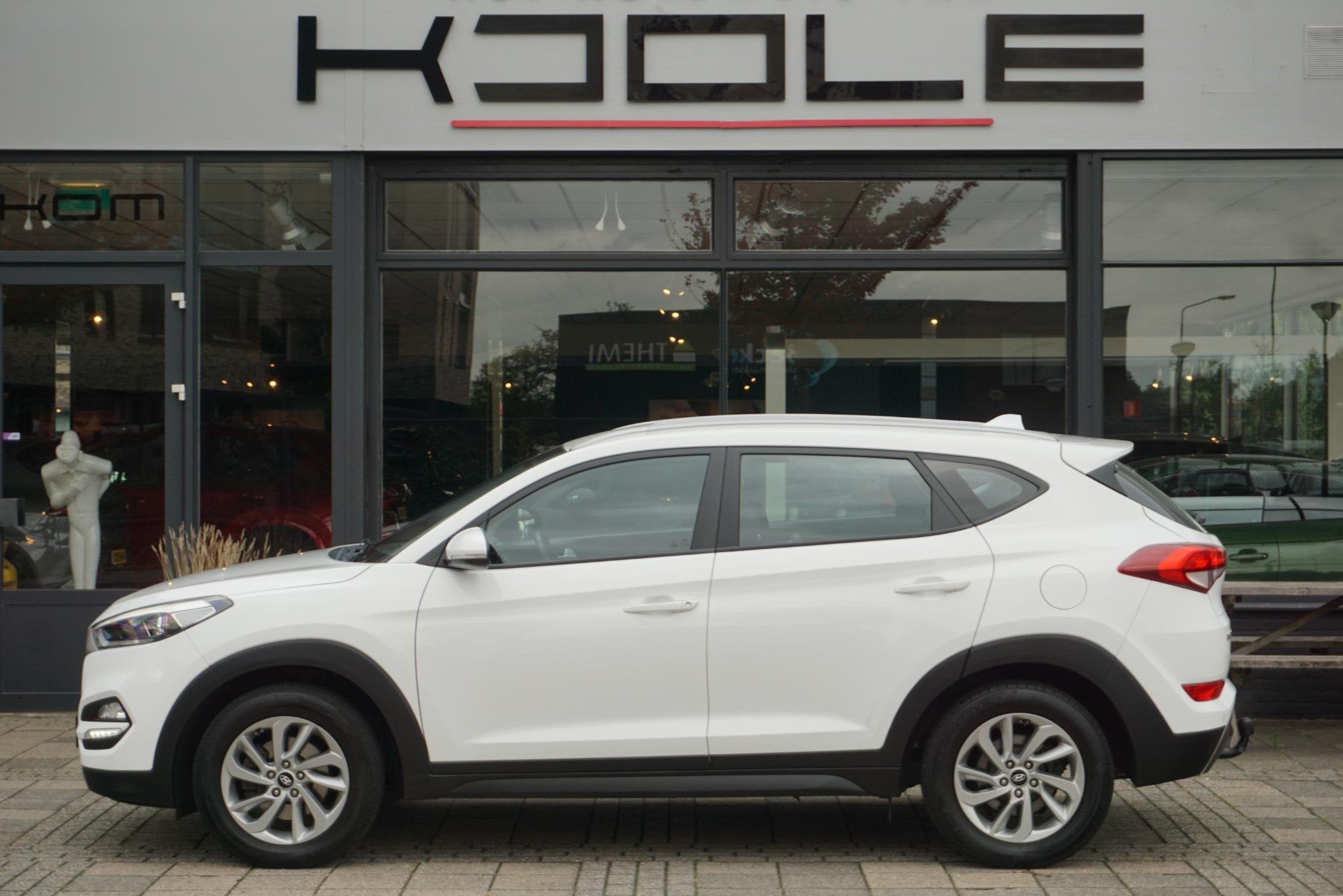 Hyundai Tucson 1.6 T-GDi Comfort 4WD | trekhaak, Auto's, Stof, Gebruikt, 4 cilinders, Wit
