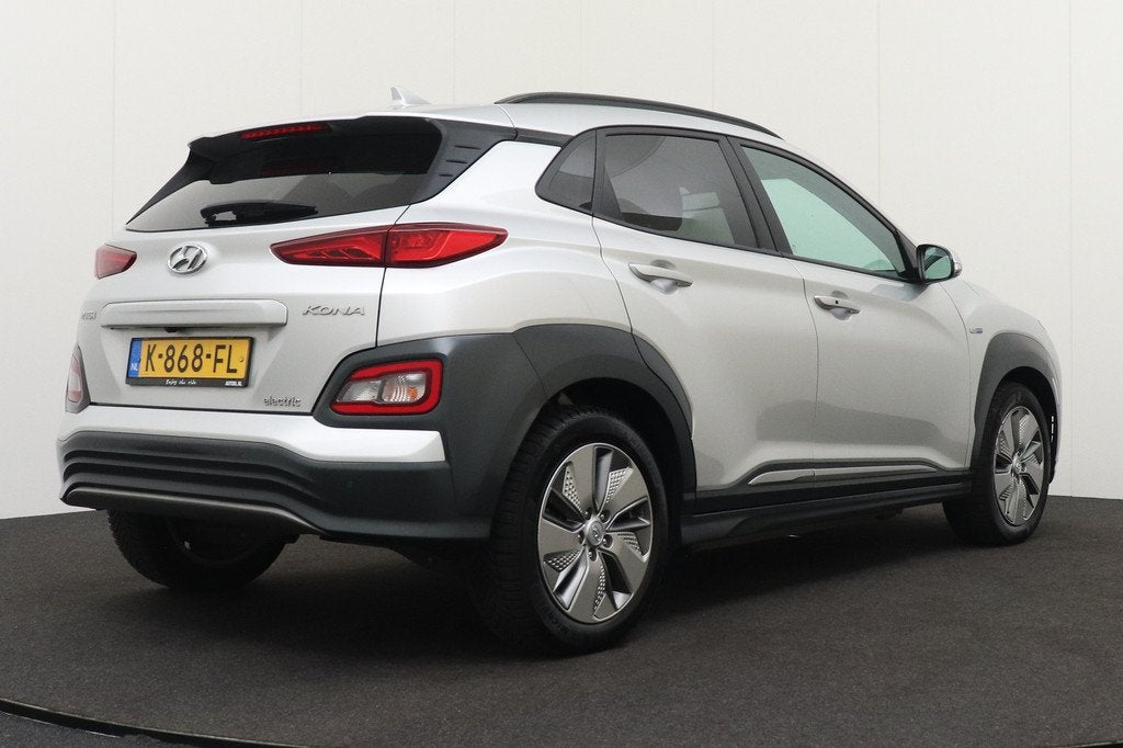 Hyundai KONA EV Fashion 64 kWh (94%SOH) Warmtepomp Head-Up D, Auto's, Hyundai, Stof, Gebruikt, Zwart, Origineel Nederlands