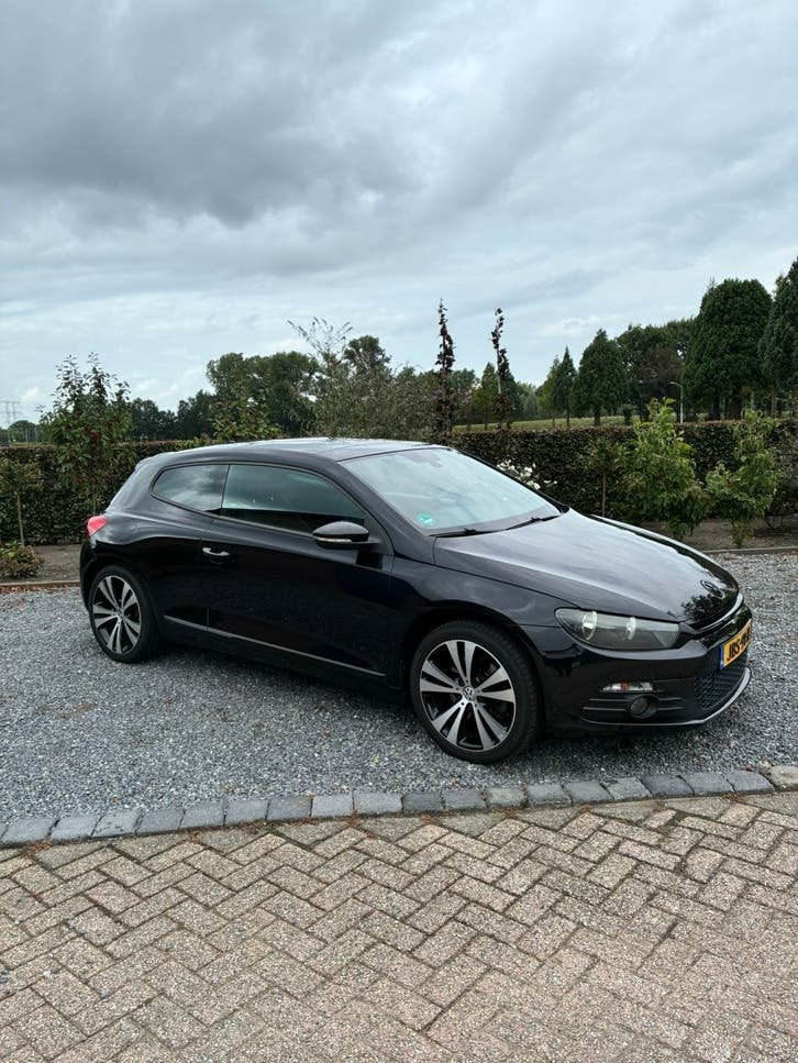 Volkswagen Scirocco 1.4 TSI 118KW DSG 2011 Zwart, Auto's, Zwart, 4 cilinders, Zwart, Geïmporteerd