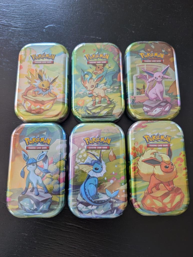 Pokémon Prismatic Evolutions Tins (sealed) - 6 stuks, Ophalen of Verzenden, Nieuw