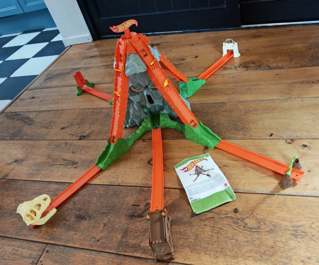 Hot Wheels Trick Tracks Dino Stunt World – 8 auto’s, Racebaan, Zelf te bouwen, Opwindmechanisme, Ophalen of Verzenden