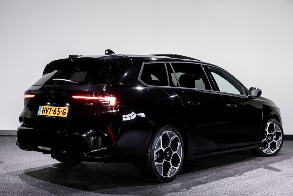Opel Astra Sports Tourer 1.6 T PHEV Ultimate | Pano | Leder, Auto's, Opel, Gebruikt, Zwart, 4 cilinders, Zwart