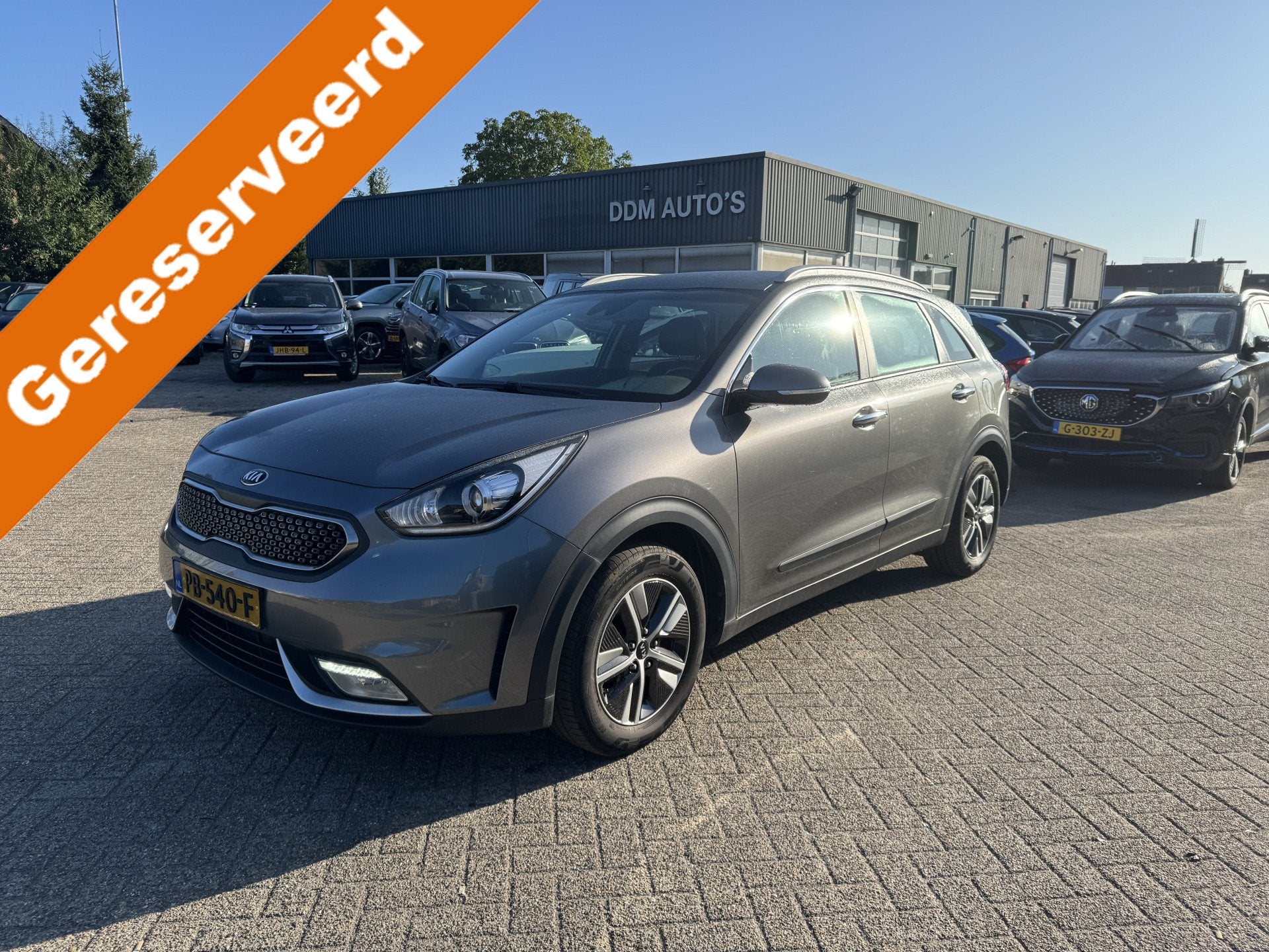 Kia Niro 1.6 GDi Hybrid First Edition (bj 2017, automaat), Auto's, Gebruikt, Euro 6, Leder en Stof, Origineel Nederlands