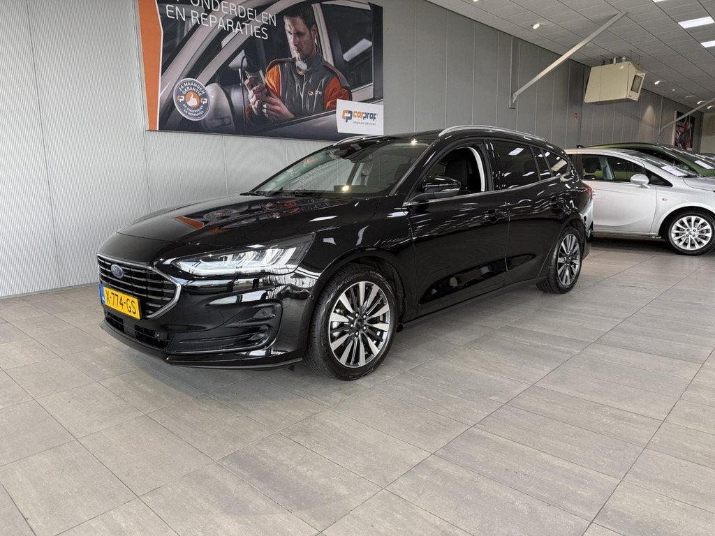 Ford Focus Wagon 1.0 EcoBoost Hybrid 155PK Automaat Titanium, Gebruikt, Euro 6, Automatische klimaatregeling, Zwart