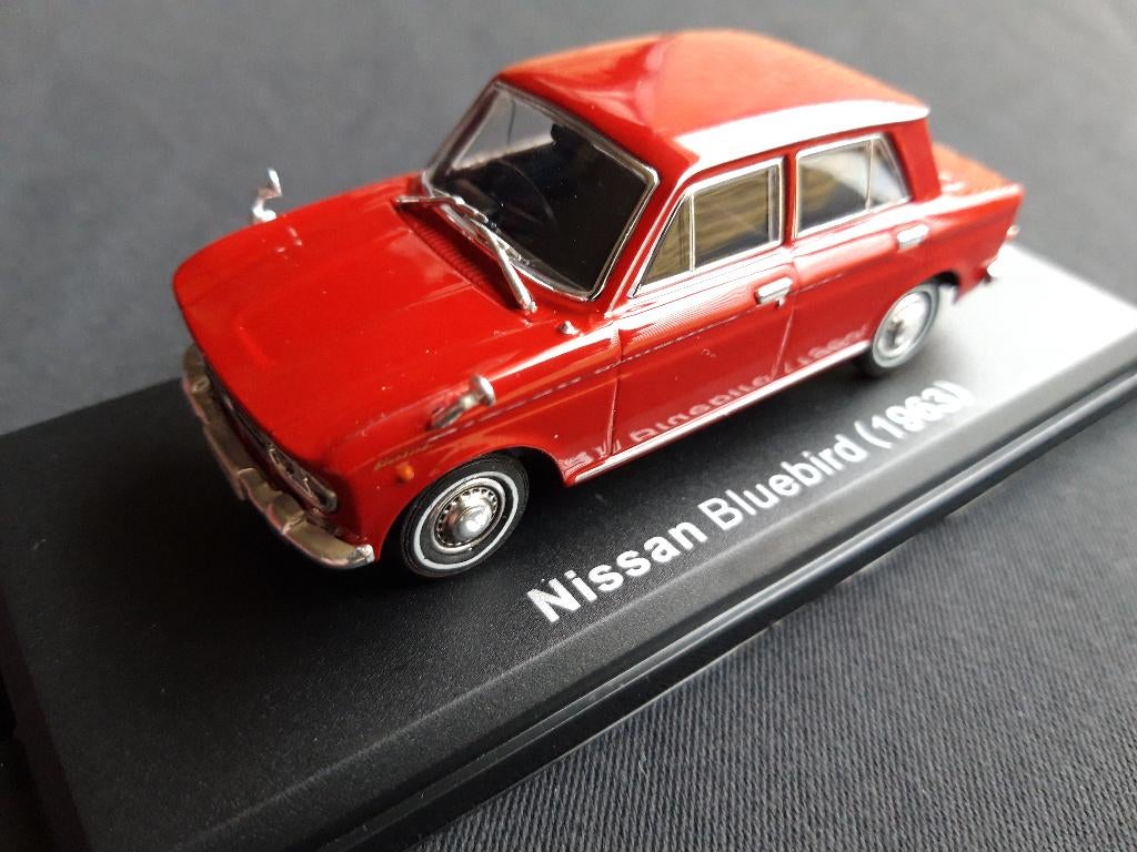Datsun Bluebird 1300 1963 donkerrood - NISSAN 1:43 Norev, Hobby en Vrije tijd, Modelauto's | 1:43, Ophalen of Verzenden, Zo goed als nieuw