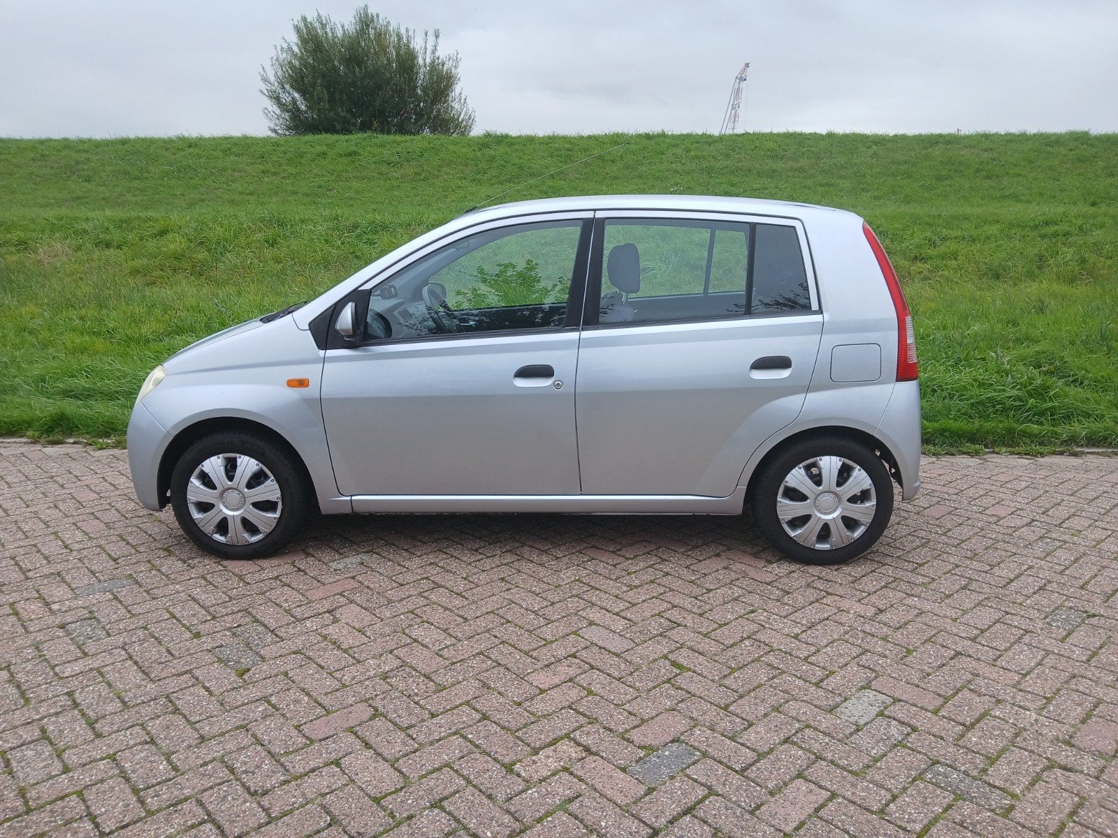 Daihatsu Cuore 1.0 AUT 2003 Grijs, Auto's, Centrale vergrendeling, Stof, 600 kg, Zwart
