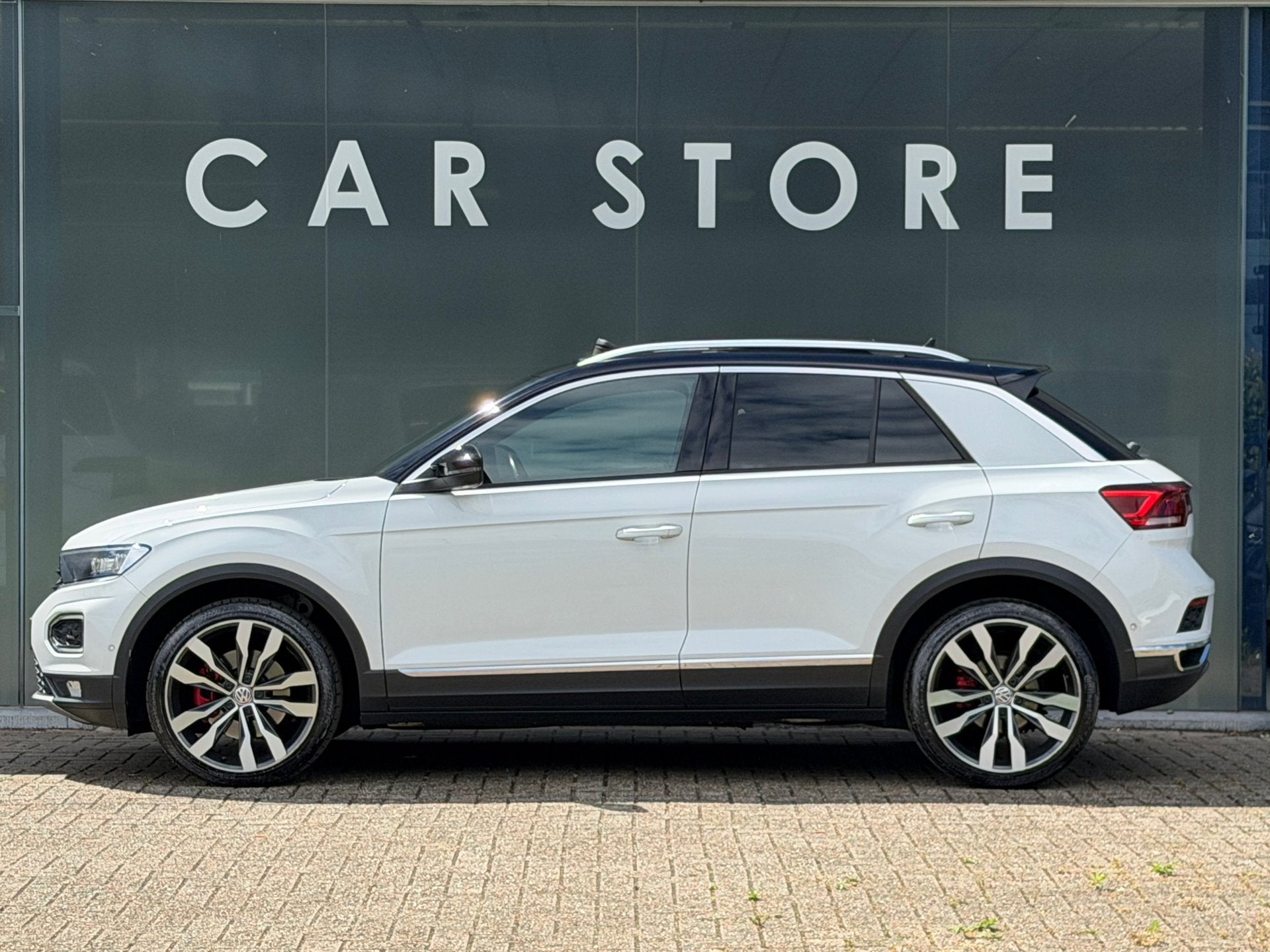 Volkswagen T-Roc 2.0 TSI 4Motion Sport Pano / Beats / Camera, Auto's, Volkswagen, Automaat, Gebruikt, 1984 cc, Wit