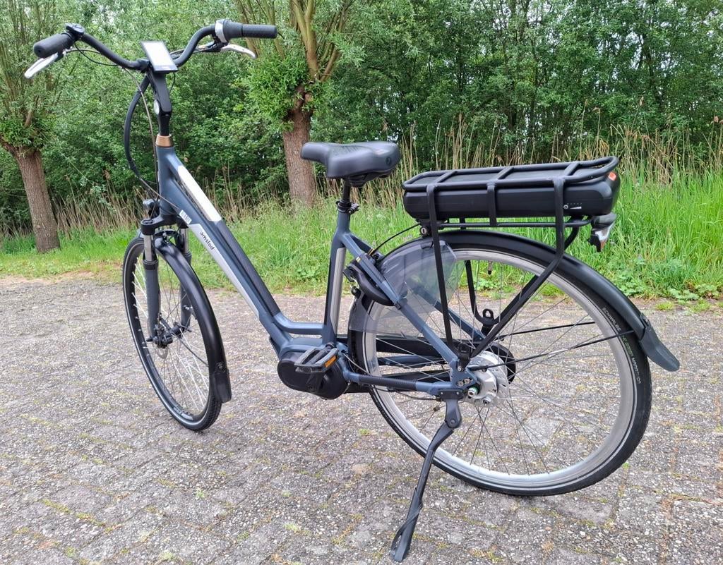 Comfortabele elektrische Amslod damesfiets, Middenmotor ✅️, 53 tot 56 cm, Versnellingen, Zo goed als nieuw, Schijfrem