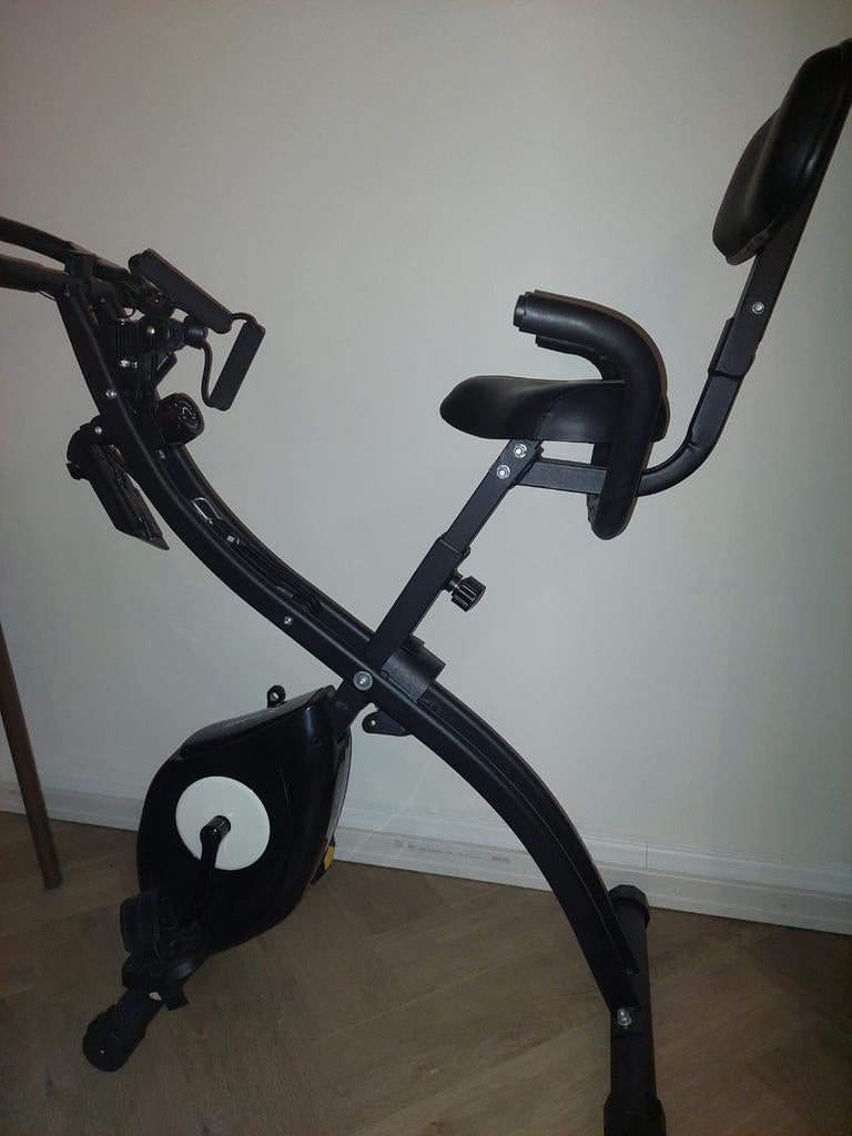 Hometrainer met rugleuning en weerstandsbanden, Ophalen