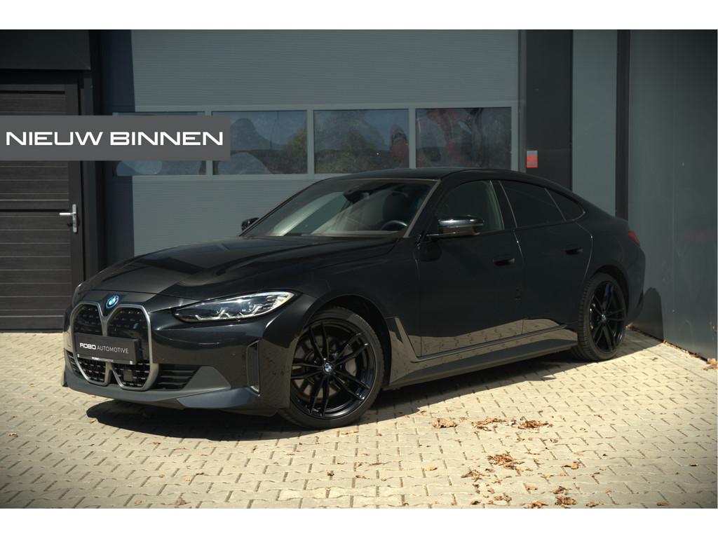 BMW i4 eDrive40 84 kWh | Stoelverwarming | Stuurverwarming |, Auto's, BMW, Achterwielaandrijving, Gebruikt, Zwart, Zwart