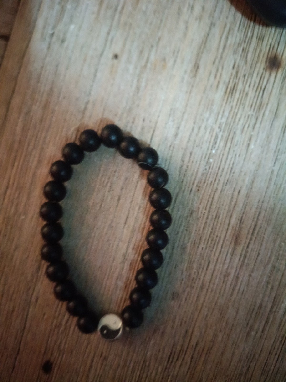 Zwarte kralenarmband met Yin Yang bedel, Gebruikt, Zwart, Ophalen of Verzenden, Elastiek
