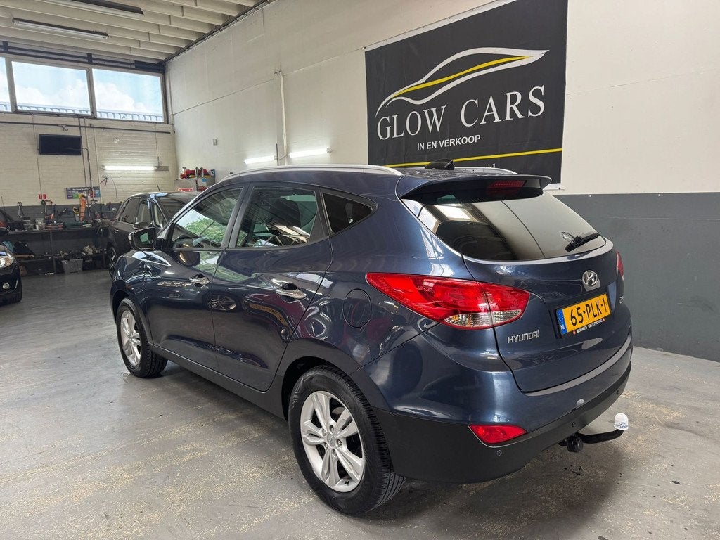 Hyundai Ix35 2.0i Style AIRCO|CRUISE|PDC|TREKHAAK|BLUETOOTH|, Auto's, Hyundai, Zwart, 4 cilinders, Blauw, Leder en Stof