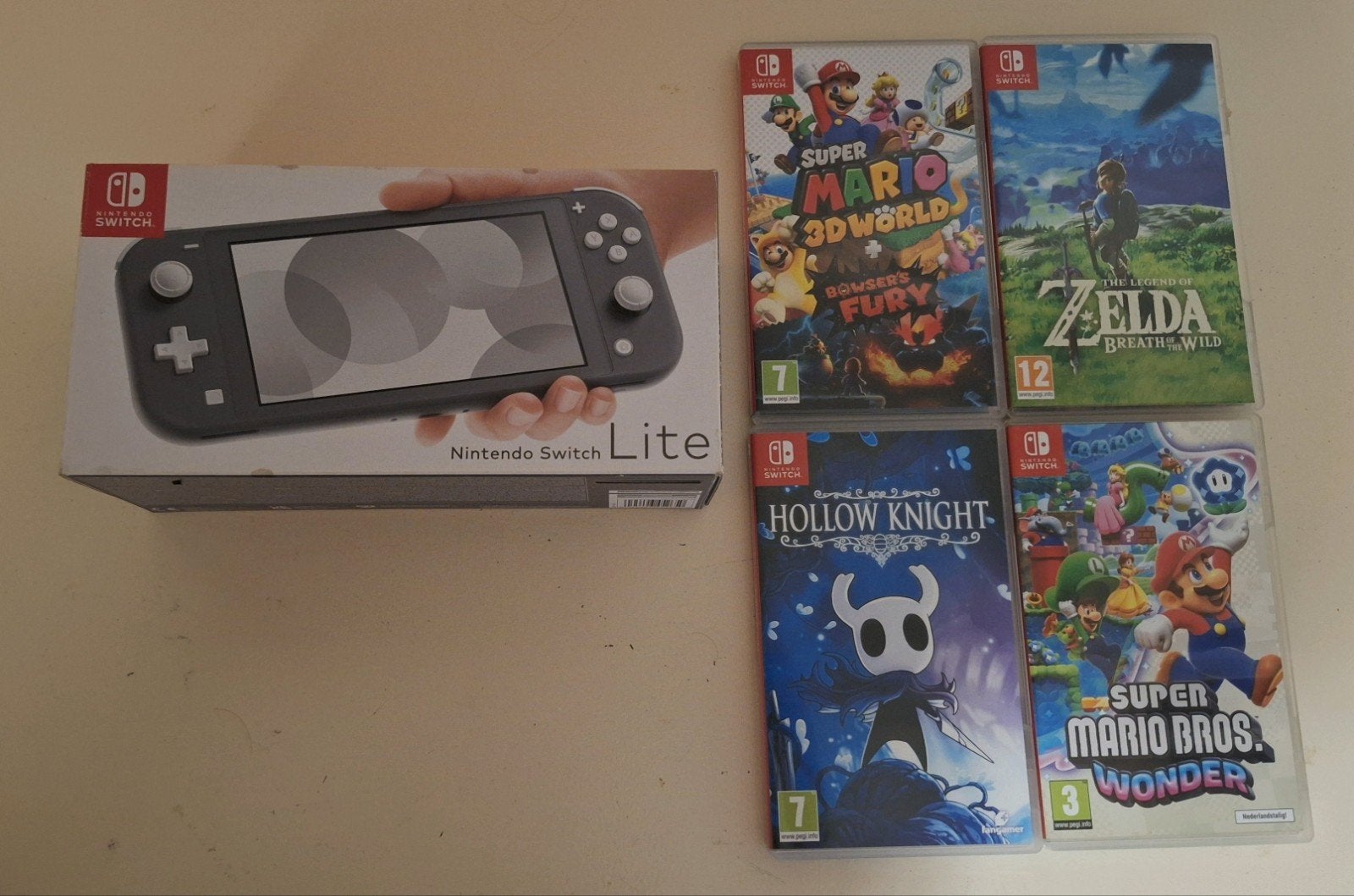 Nintendo Switch Lite - inclusief 4 spellen, Spelcomputers en Games, Ophalen, Grijs, Gebruikt