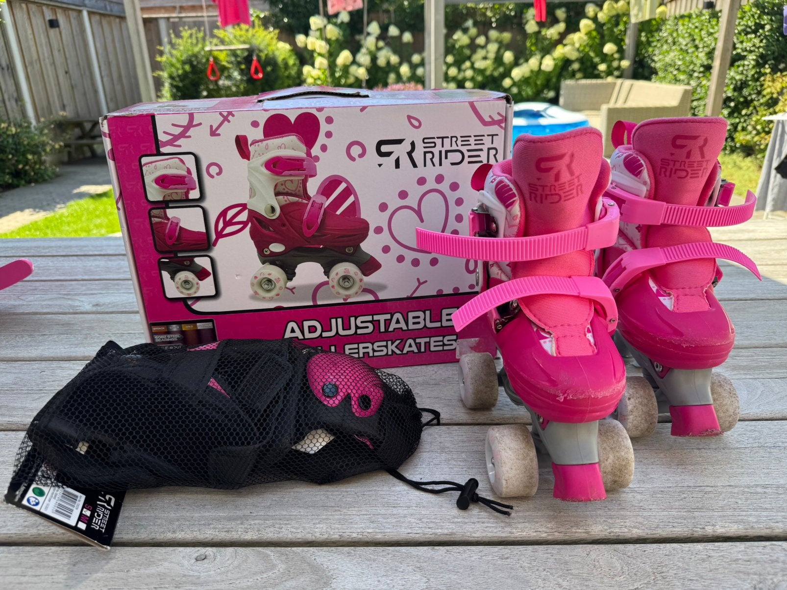 Roze kinderrolschaatsen met bescherming, Ophalen, Zo goed als nieuw
