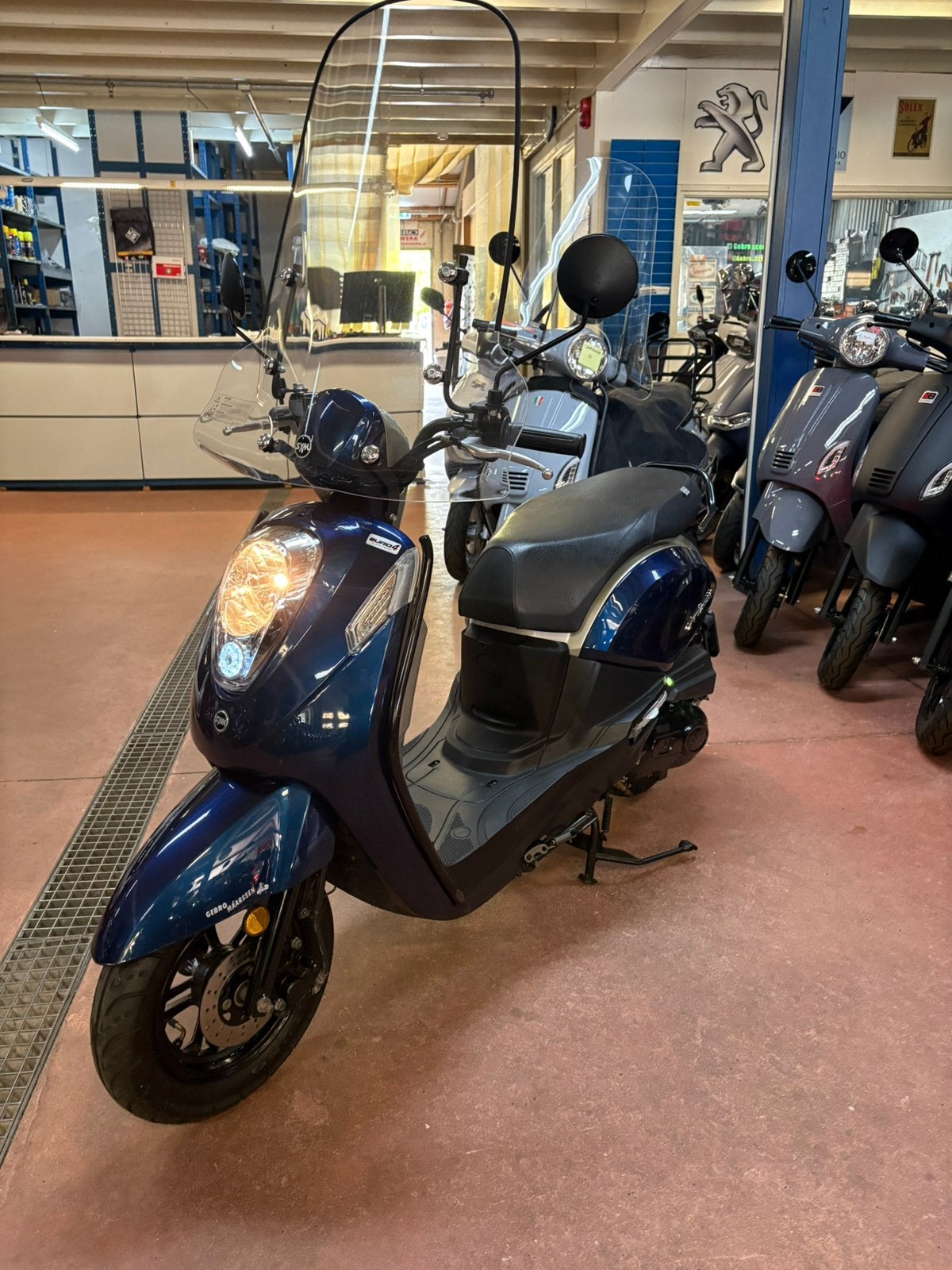 Gebro scooters: Sym mio i 25KM SNOR blauw BJ2020, Fietsen en Brommers, Scooters | SYM, Mio, Ophalen of Verzenden, Zo goed als nieuw