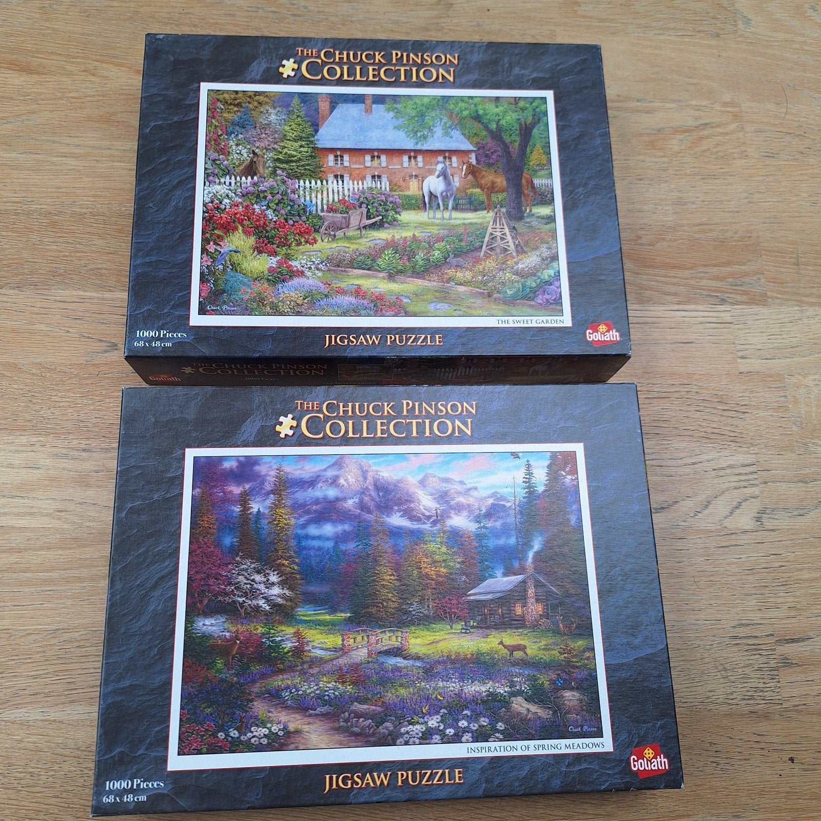 2x Chuck Pinson Jigsaw Puzzels 1000 stukjes Goliath, Hobby en Vrije tijd, Denksport en Puzzels, Ophalen, 500 t/m 1500 stukjes