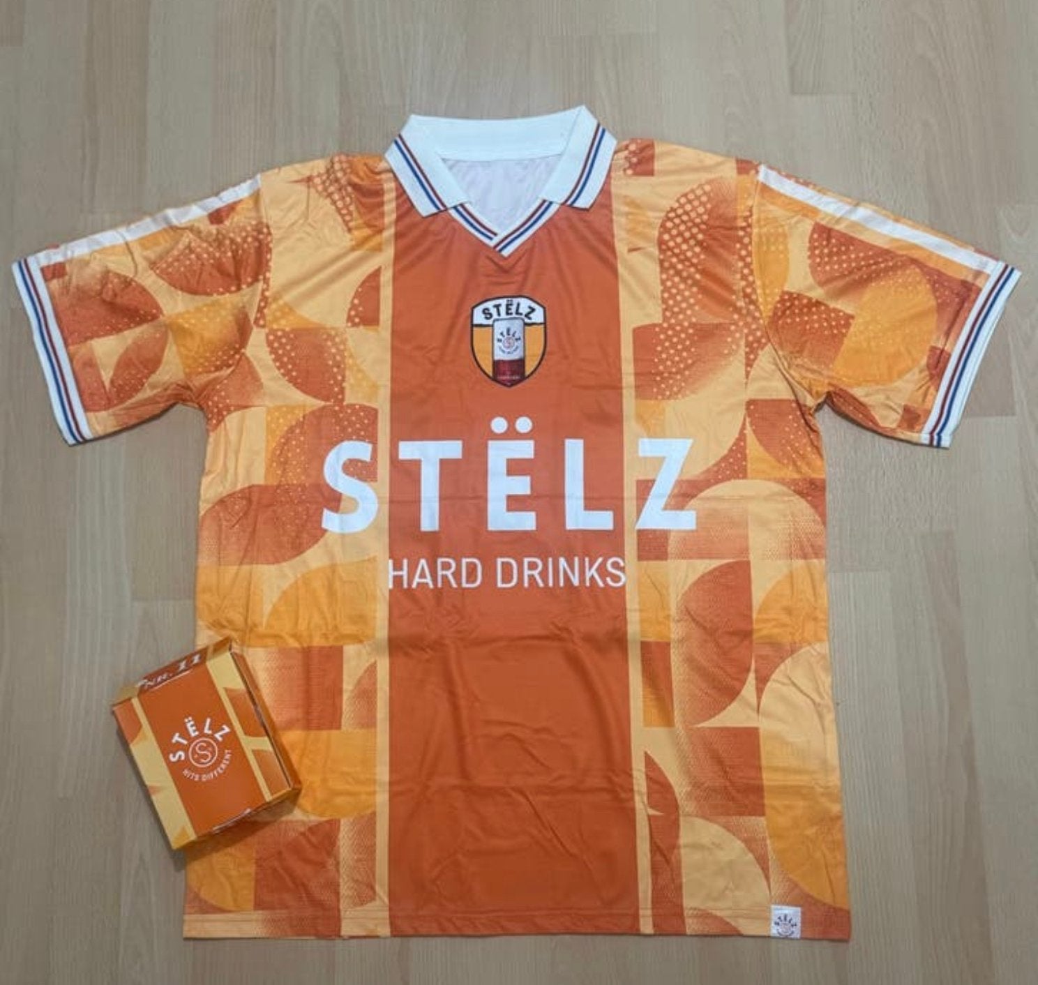 Stëlz Voorspelshirt L/XL - Nieuw in doos, Kleding | Heren, Sportkleding, Maat 52/54 (L), Nieuw, Oranje, Ophalen of Verzenden