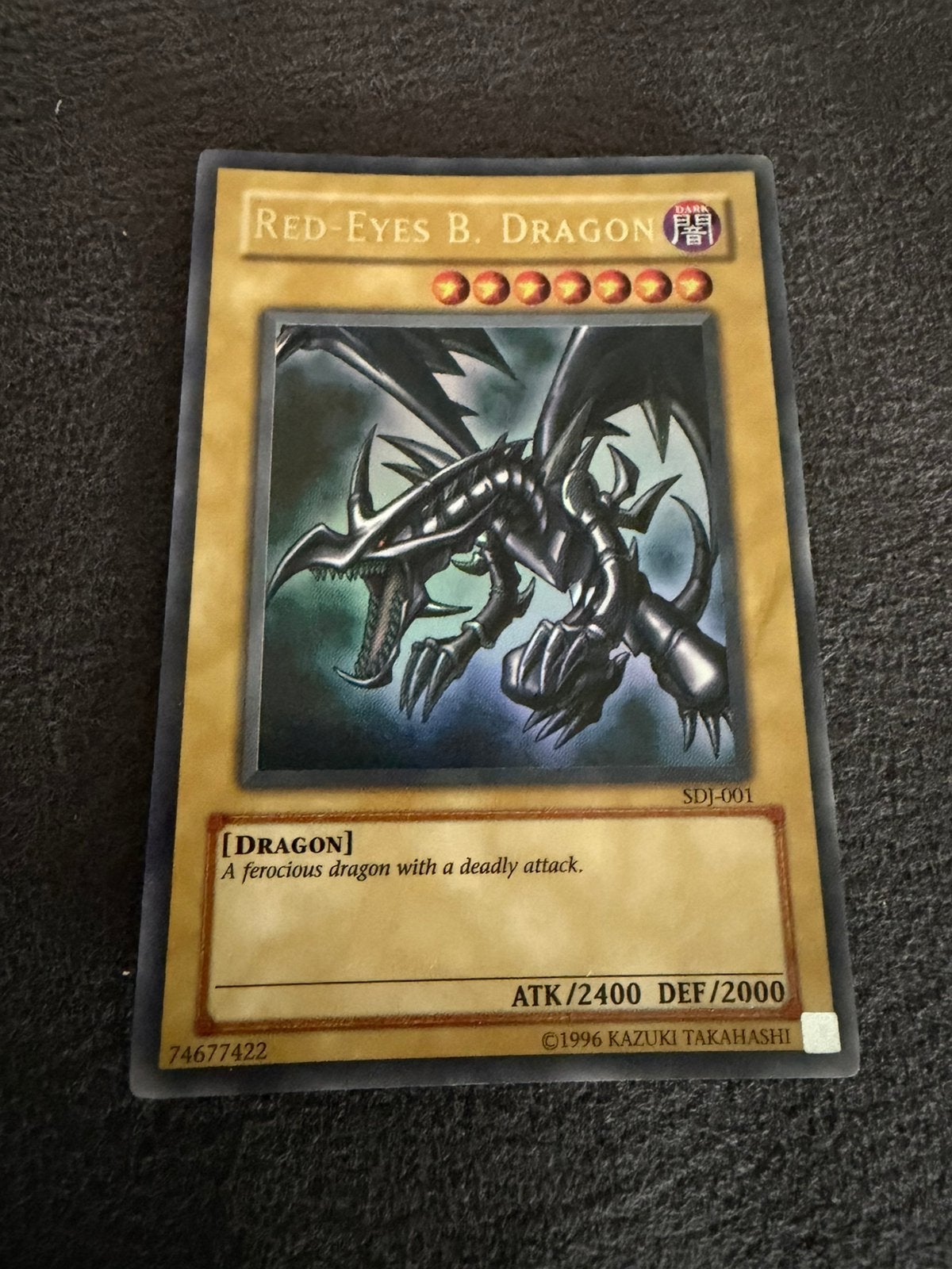 YuGiOh Red Eyes Black Dragon SDJ-001, Ophalen of Verzenden, Gebruikt