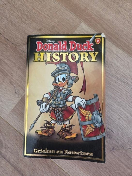 Donald Duck History 2: Grieken en Romeinen, Eén stripboek, Ophalen of Verzenden, Gelezen