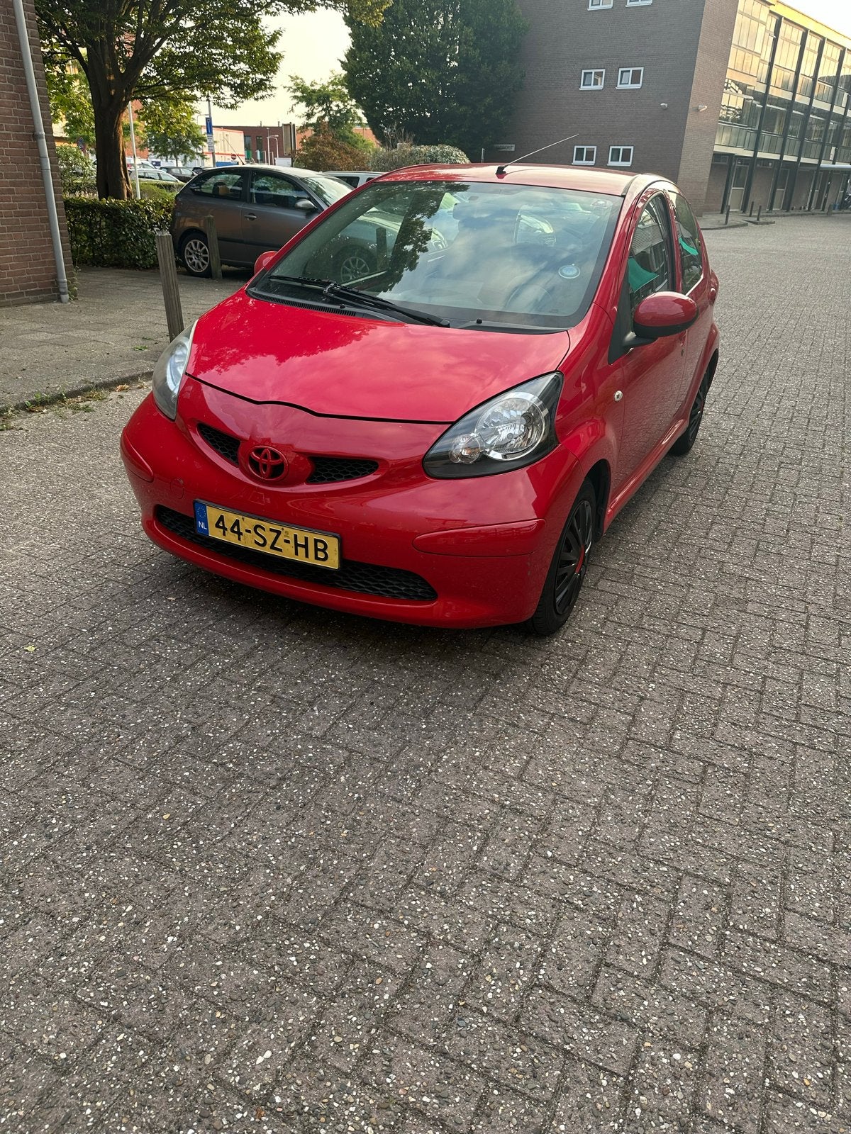Toyota Aygo 1.0 12V Vvt-i 5DRS 2006 Rood, Auto's, Toyota, Voorwielaandrijving, 4 stoelen, 68 pk, Origineel Nederlands