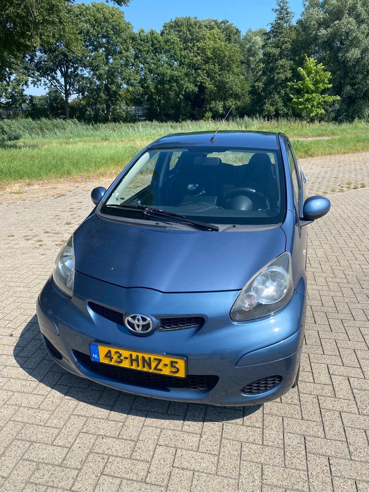 Toyata Aygo 2009  5 deurs schade vrij airco ijskoud, Auto's, Voorwielaandrijving, Stof, Zwart, Blauw