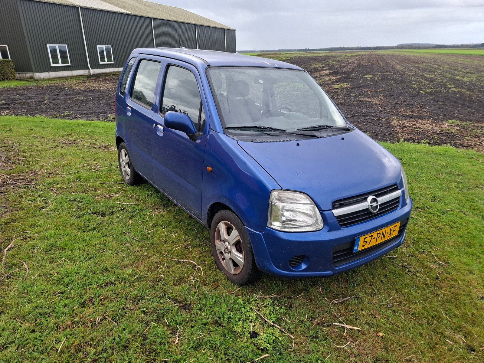 Opel Agila 1.2 I 16V 2004 Blauw, Auto's, Voorwielaandrijving, Blauw, Origineel Nederlands, Handgeschakeld
