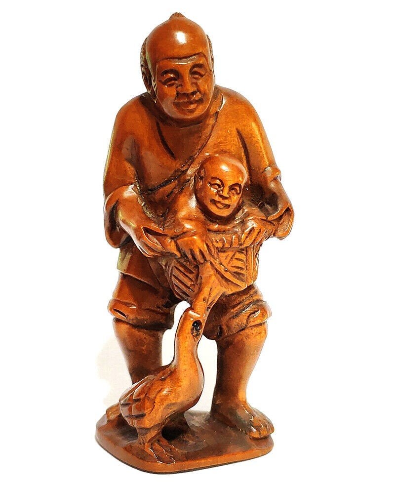  Netsuke van man met kind en kraanvogel late Meijiperiode, Antiek en Kunst, Hout, Ophalen of Verzenden, Netsuke, Japan