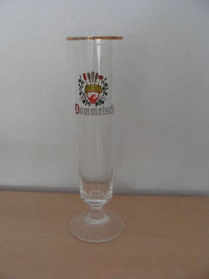 Bierglas Dommelsch Dominator - 1 glas aanwezig, Ophalen of Verzenden, Zo goed als nieuw, Glas of Glazen, Dommelsch