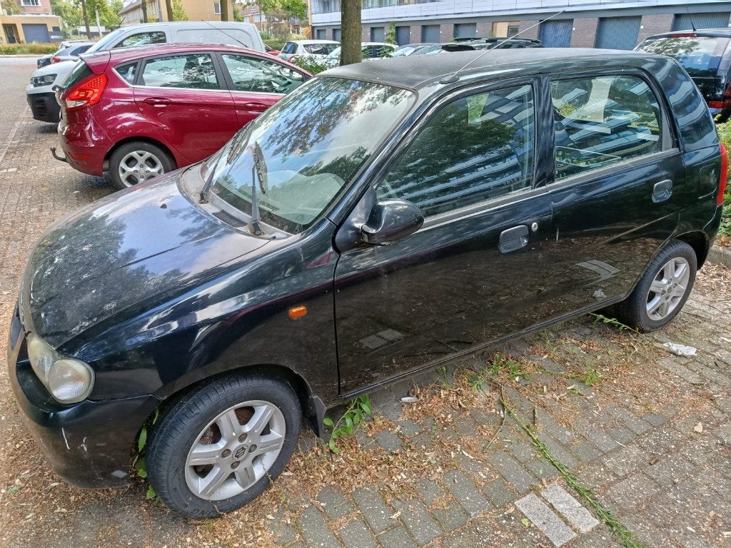 Suzuki Alto 1.1 2005 Zwart, Auto's, Voorwielaandrijving, Stof, 4 cilinders, 4 stoelen