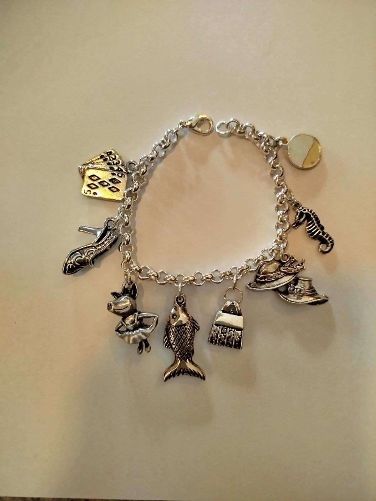 Leuke kinderarmband met diverse bedels, Ophalen of Verzenden