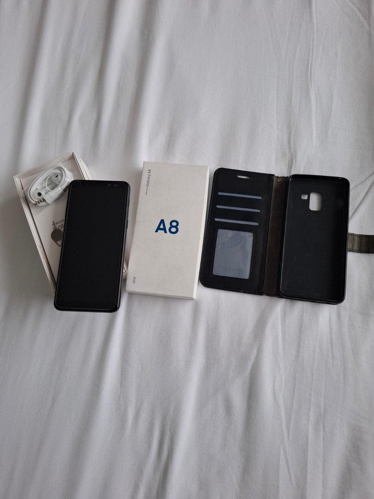 Samsung A8 32g zgan met protector erop en oortjes, Ophalen, Zo goed als nieuw, Zwart