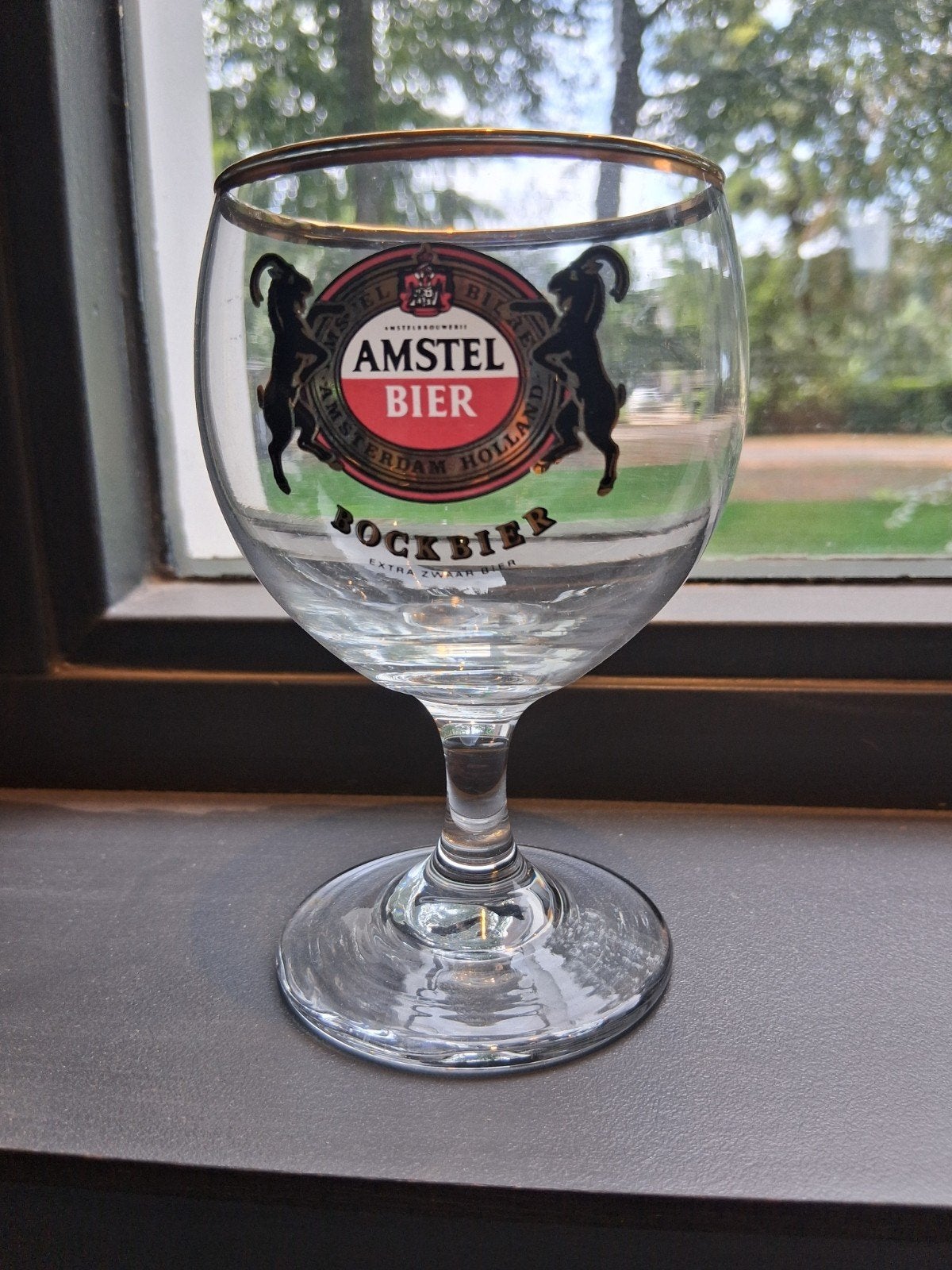 Amstel bockbier glas op voet met gouden randje, Ophalen of Verzenden, Zo goed als nieuw, Glas of Glazen, Amstel