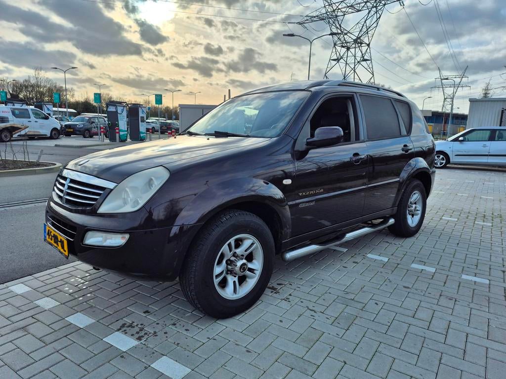 SsangYong Rexton RX 270 Xdi HR automaat, Auto's, Automaat, Gebruikt, Zwart, Stoelverwarming