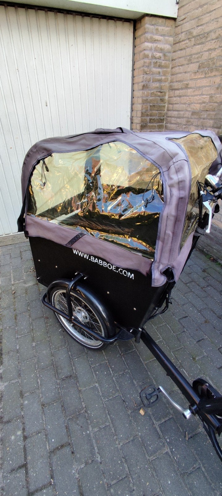 huif en zonnedak van een BAbboe big fiets, Ophalen