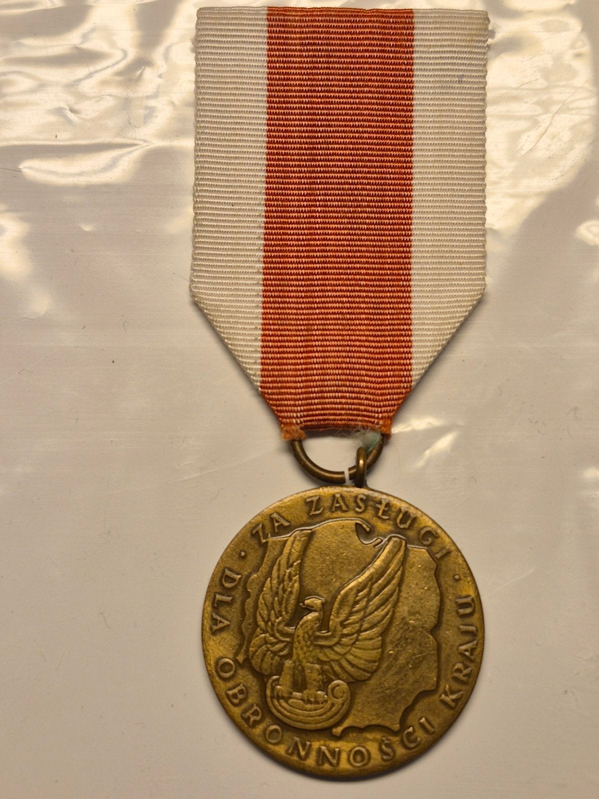 Poolse Medaille 'Za Zasługi Dla Obronności Kraju', Postzegels en Munten, Penningen en Medailles, Ophalen of Verzenden, Brons, Buitenland