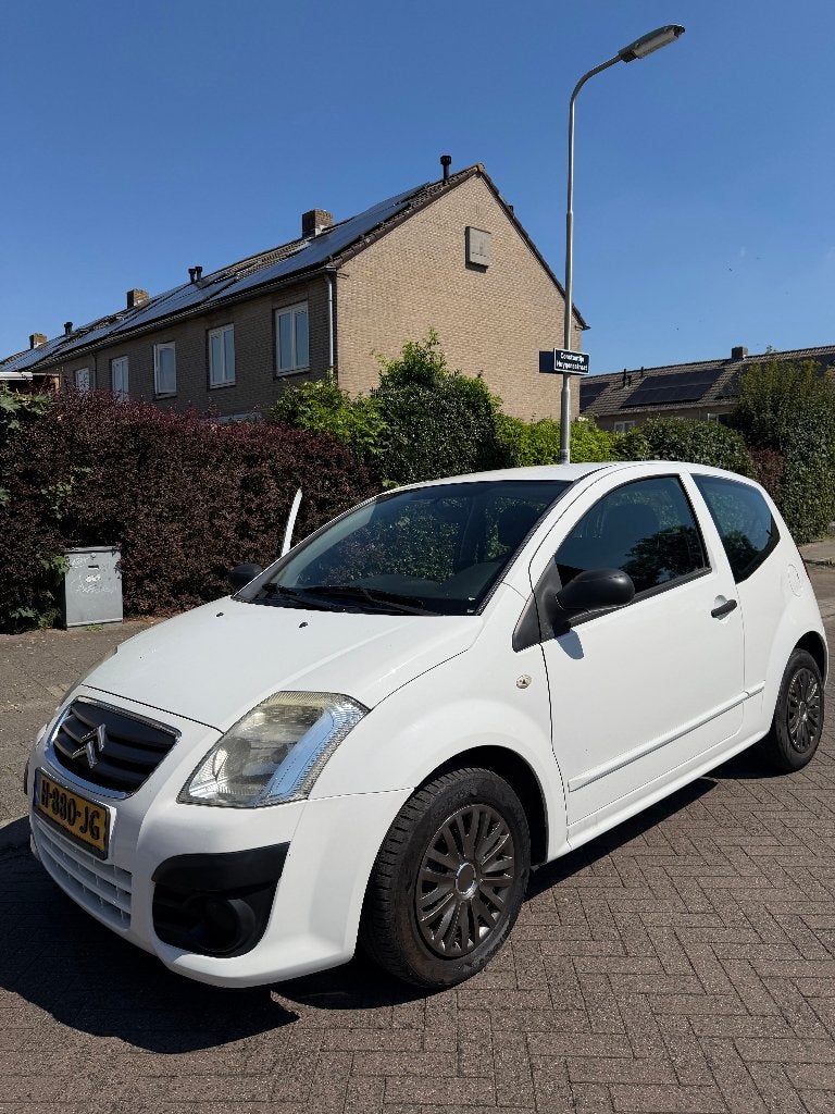 Citroën C2 1.1 I 2009 Wit, Auto's, Voorwielaandrijving, 450 kg, 31 €/maand, 4 cilinders