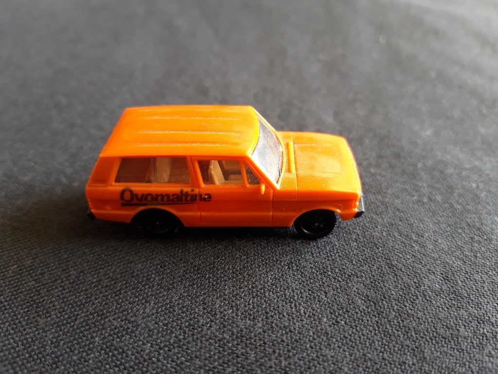 Range Rover oranje, Ovomaltine - Herpa Swiss Collection H0, Ophalen of Verzenden, Zo goed als nieuw, Auto, Herpa