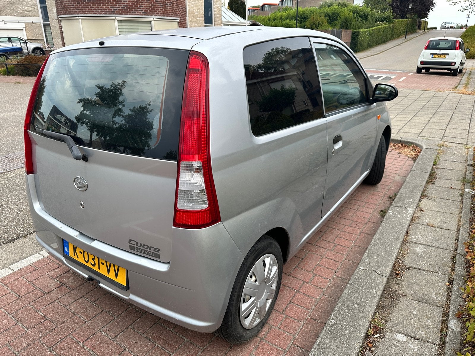 Daihatsu Cuore 1.0 3D 2005 Grijs, Auto's, Daihatsu, Stof, 600 kg, Zwart, 18 €/maand