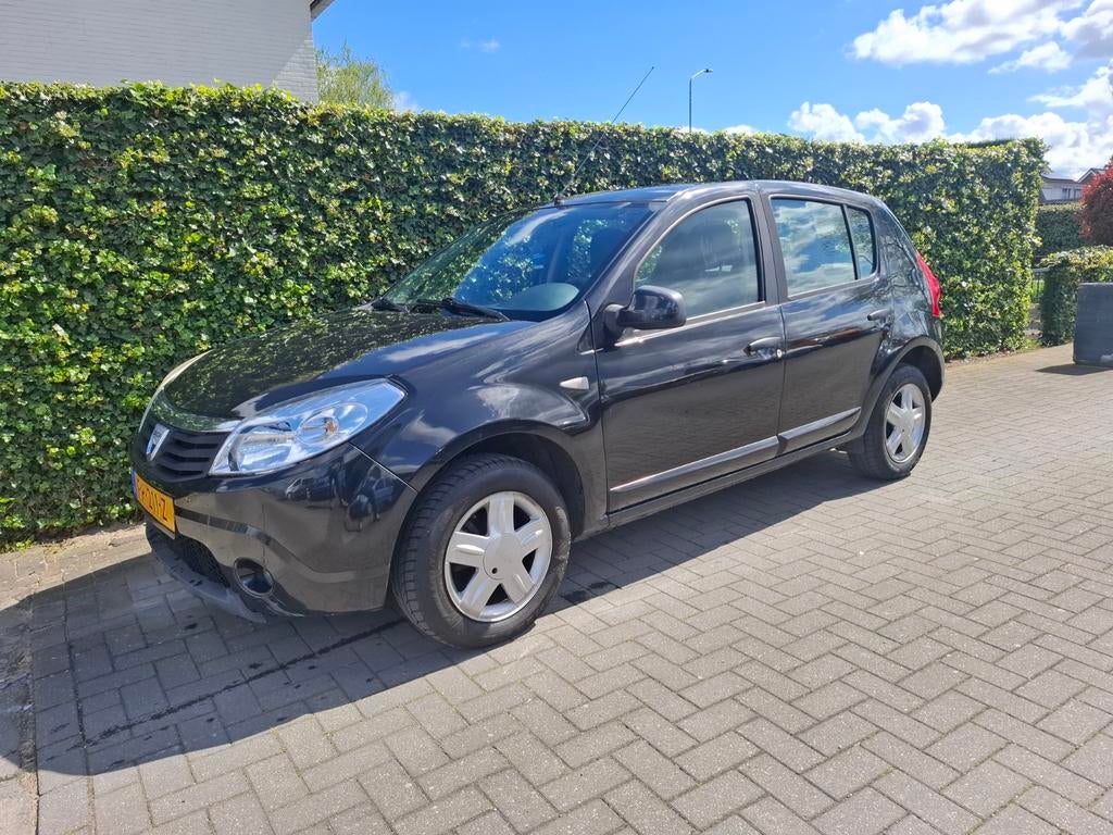 Dacia Sandero 1.2 16V 2010 Zwart, Auto's, Dacia, Voorwielaandrijving, Stof, 74 pk, Zwart