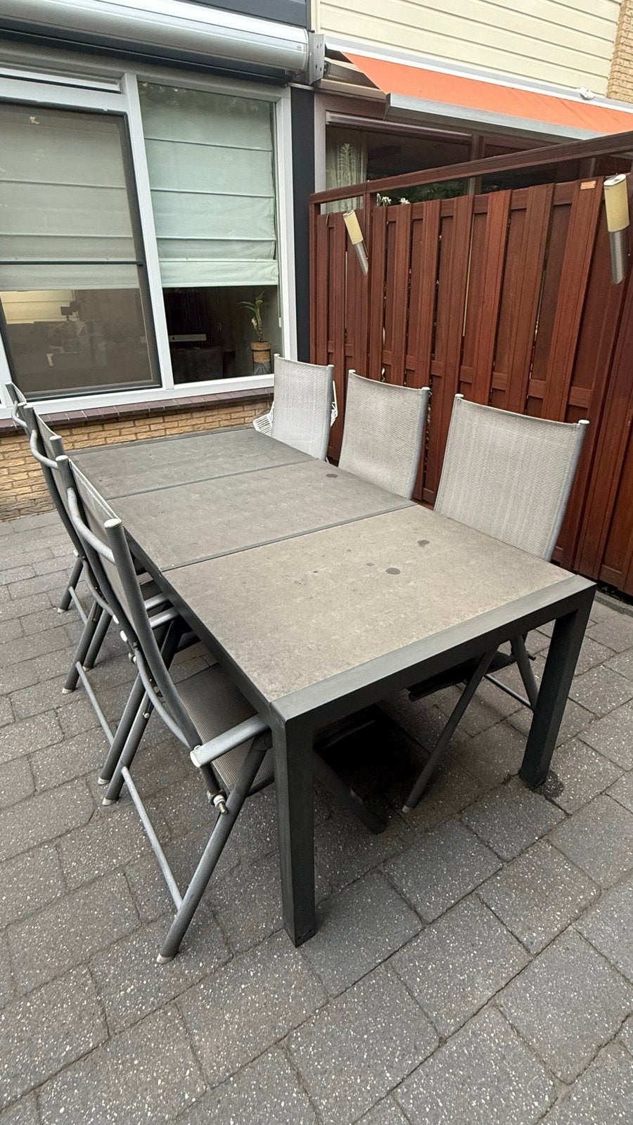 Grote tuintafel met natuursteen blad en 6 standenstoelen, Tuin en Terras, Tuintafels, Ophalen, Gebruikt, Rechthoekig, Overige materialen