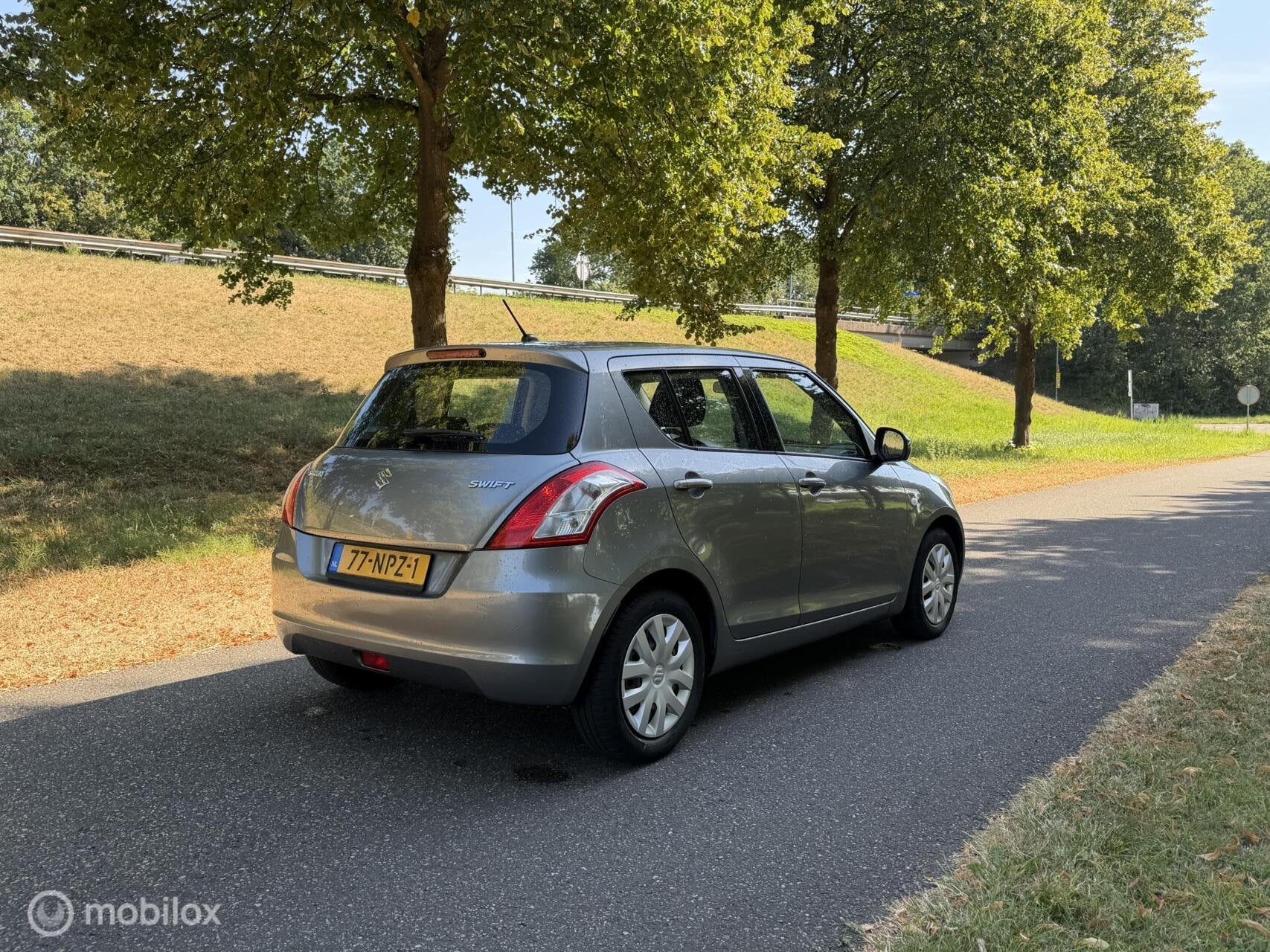 Suzuki Swift 1.2 Comfort*NEW APK 08/27*AIRCO*STOELVERWARMING, Auto's, Voorwielaandrijving, Stof, 4 cilinders, 400 kg