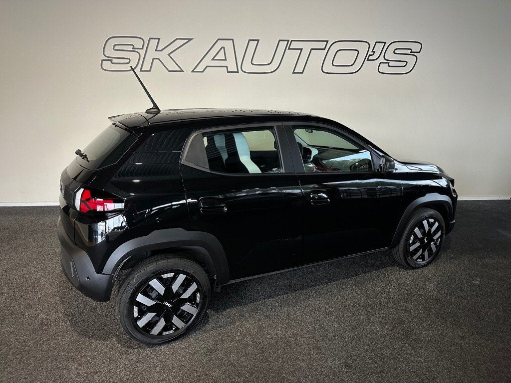 Dacia SPRING EXTREME 65 26.8 KWH l AIRCO l 5DRS l CRUISE l, Auto's, Gebruikt, Overige modellen, 4 stoelen, Zwart