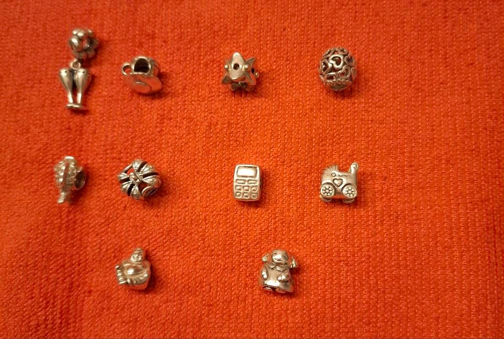 10 zilveren Pandora bedels, Pandora, Ophalen of Verzenden, Zo goed als nieuw, 4 bedels of meer